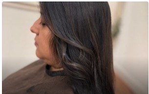 Healthy glossy dark hair after the appointment