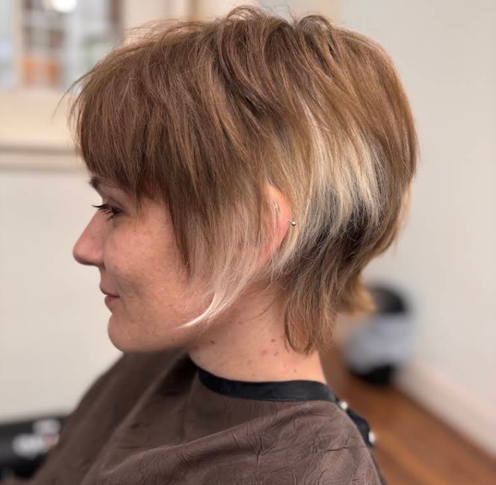 Layered pixie cut with blonde block colour panel