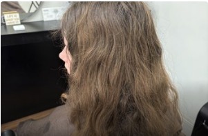 Long dark wavy hair before colouring